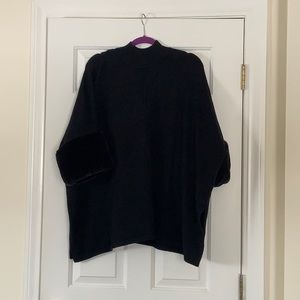 Black poncho with fur sleeves